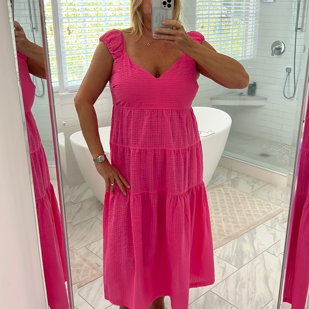Gauzy pink sundress with puffy over the shoulder sleeves and tie back